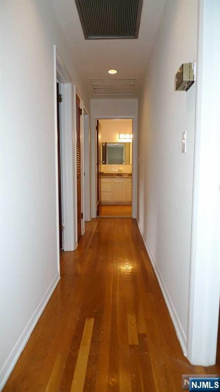 48 Rock Road Englewood Cliffs, NJ 07632 - Photo 14 of 23 a view of a hallway with wooden floor
