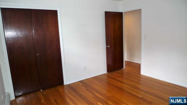 48 Rock Road Englewood Cliffs, NJ 07632 - Photo 18 of 23 a view of an empty room with wooden floor
