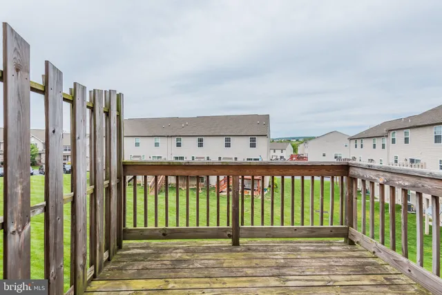 a view of a balcony with furniture