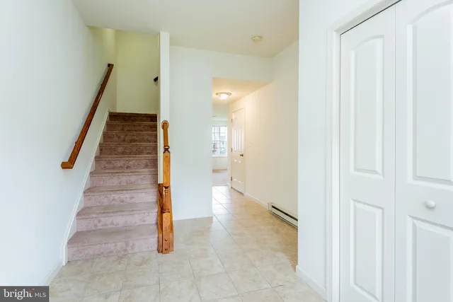 a view of entryway and hall with a hallway