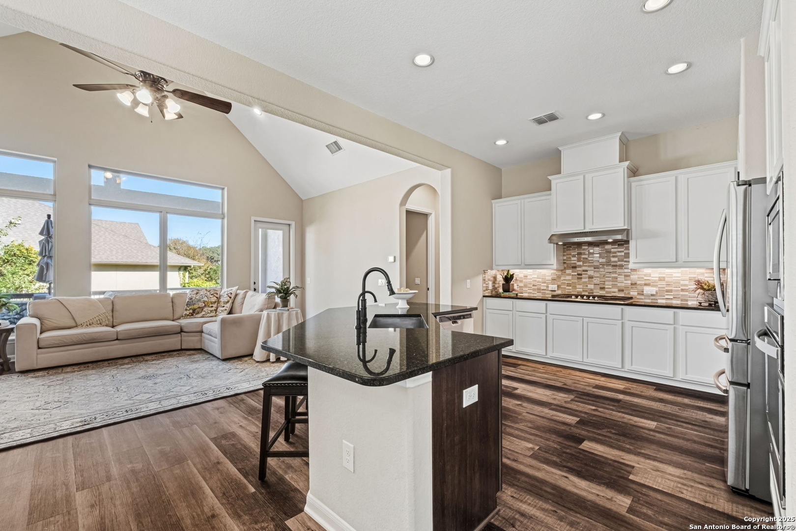 105 Gaucho Boerne, TX 78006 - Photo 12 of 29 a kitchen with stainless steel appliances granite countertop a stove refrigerator and cabinets