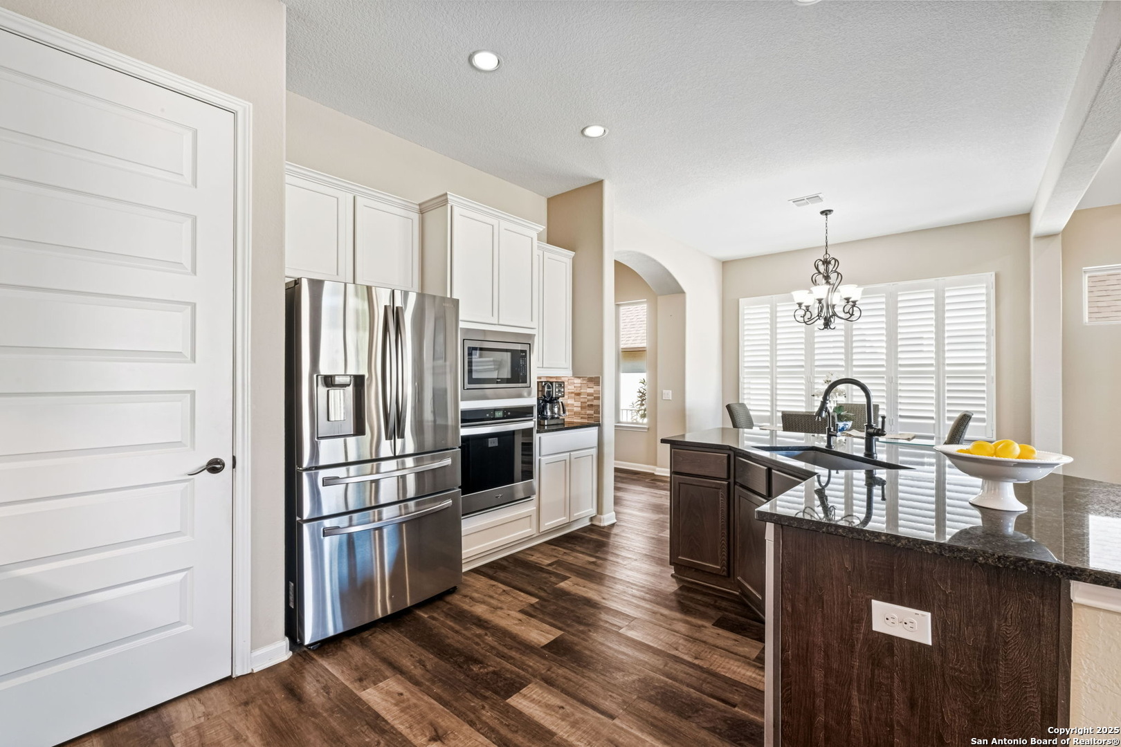 105 Gaucho Boerne, TX 78006 - Photo 14 of 29 a kitchen with granite countertop a refrigerator stove and sink