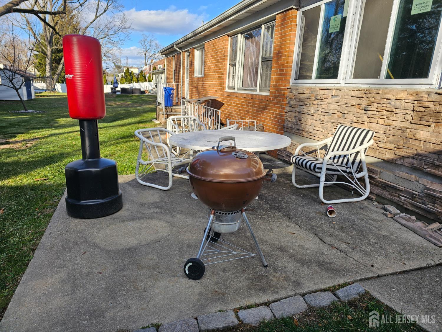 43 Westons Mill Road East Brunswick, NJ 08816 - Photo 5 of 5 a view of a chairs and table in backyard