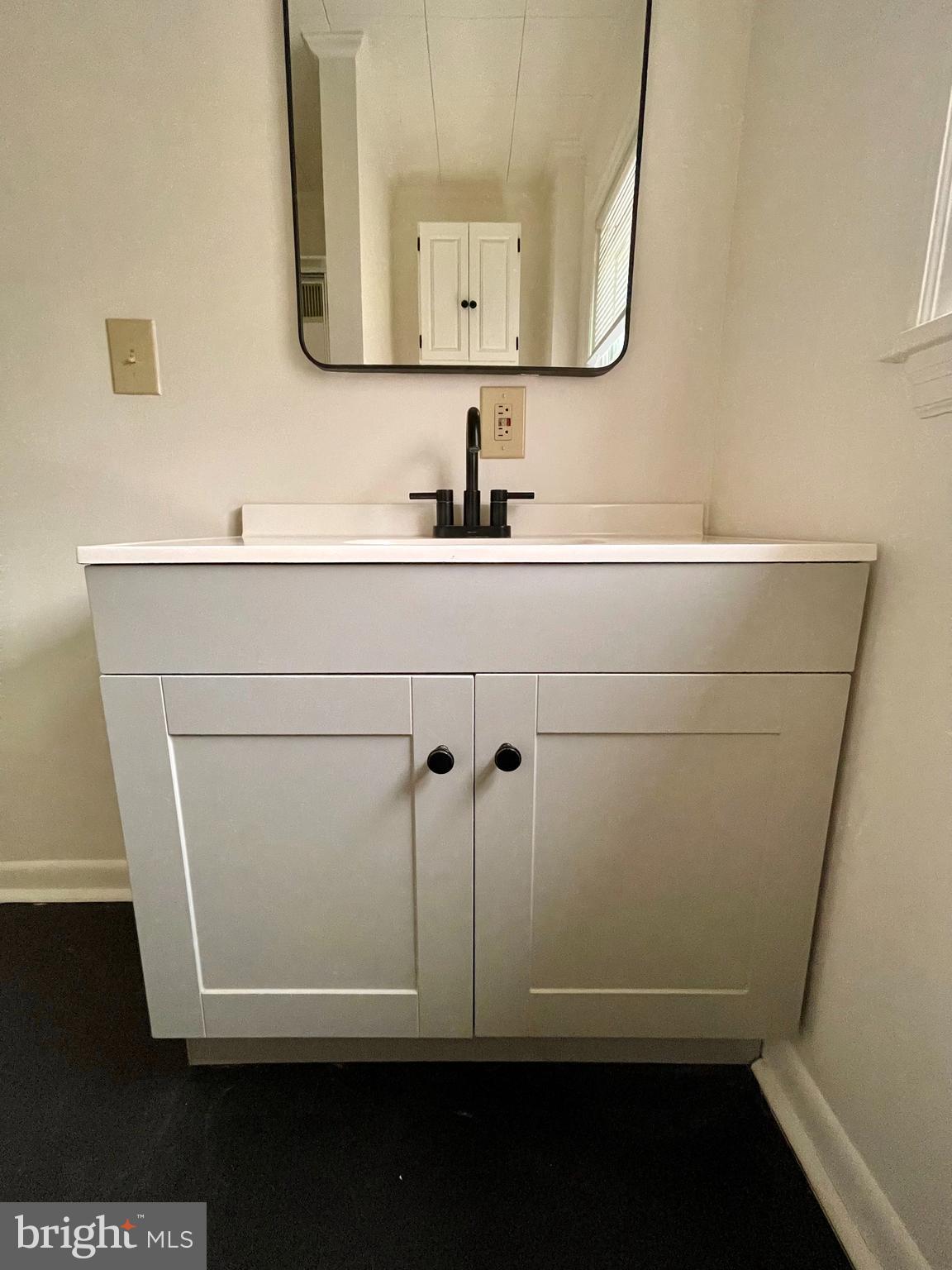 1136 Union Street Lancaster, PA 17603 - Photo 14 of 24 a bathroom with a sink a mirror and vanity
