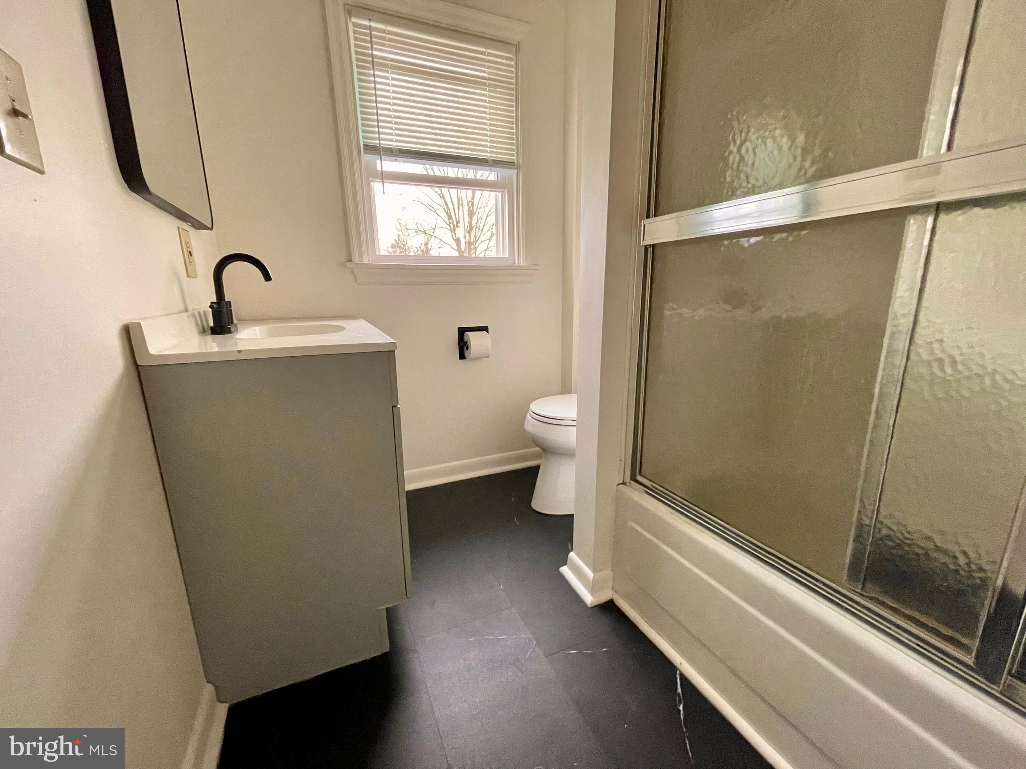 1136 Union Street Lancaster, PA 17603 - Photo 15 of 24 a bathroom with a sink a toilet and shower