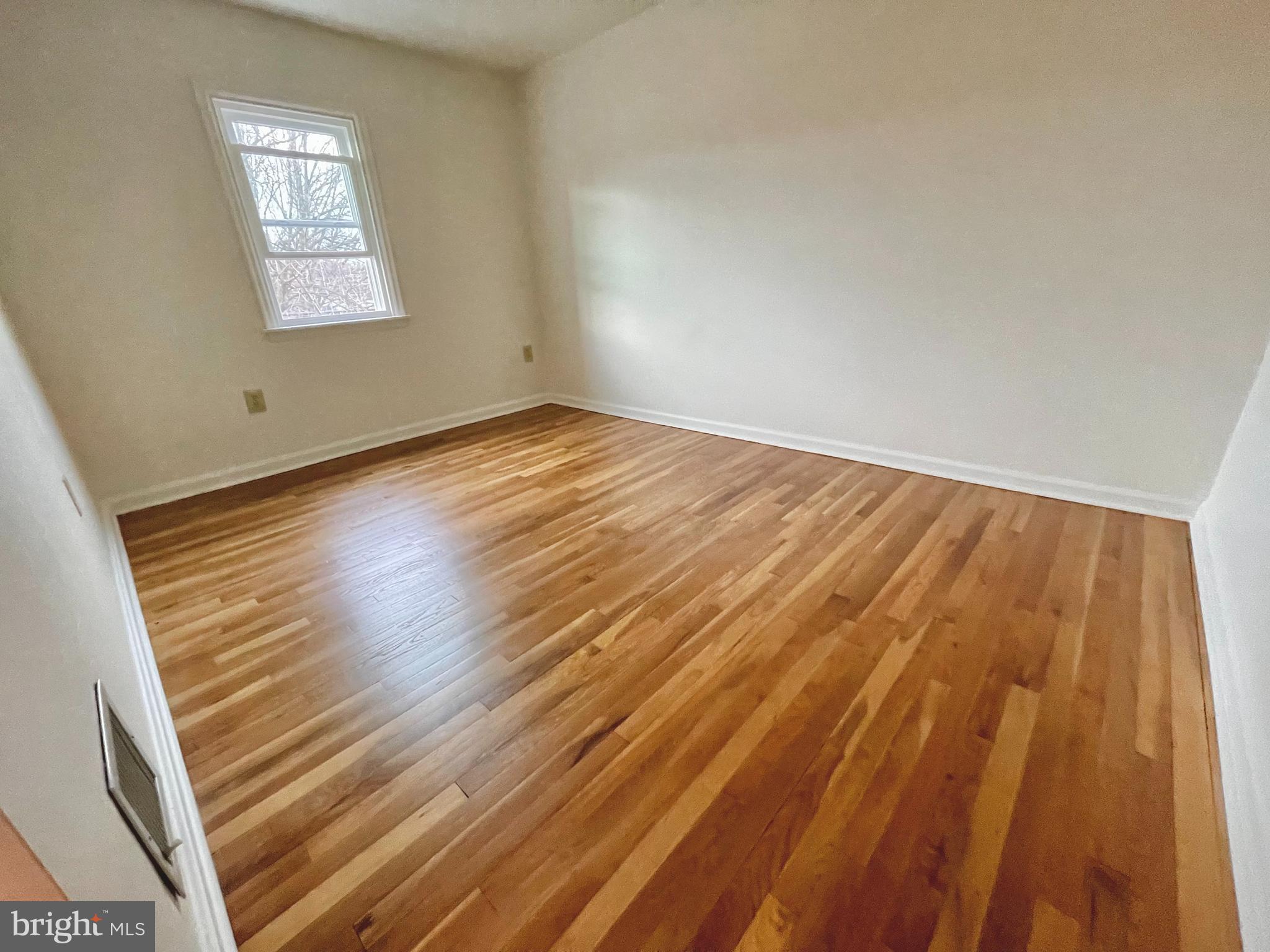 1136 Union Street Lancaster, PA 17603 - Photo 17 of 24 a view of an empty room and wooden floor