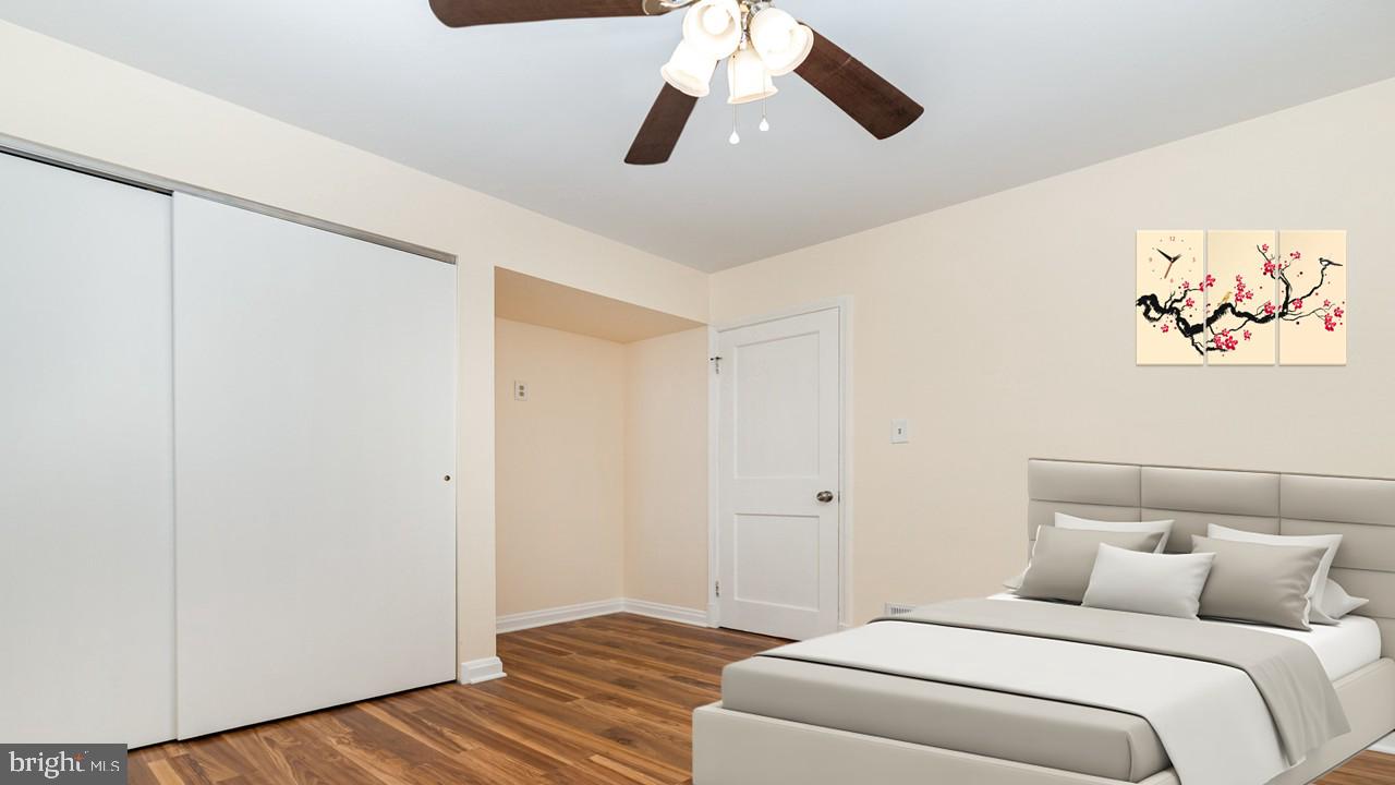 6301 Fieldvale Road Baltimore, MD 21237 - Photo 10 of 44 a bedroom with a bed and a painting on the wall