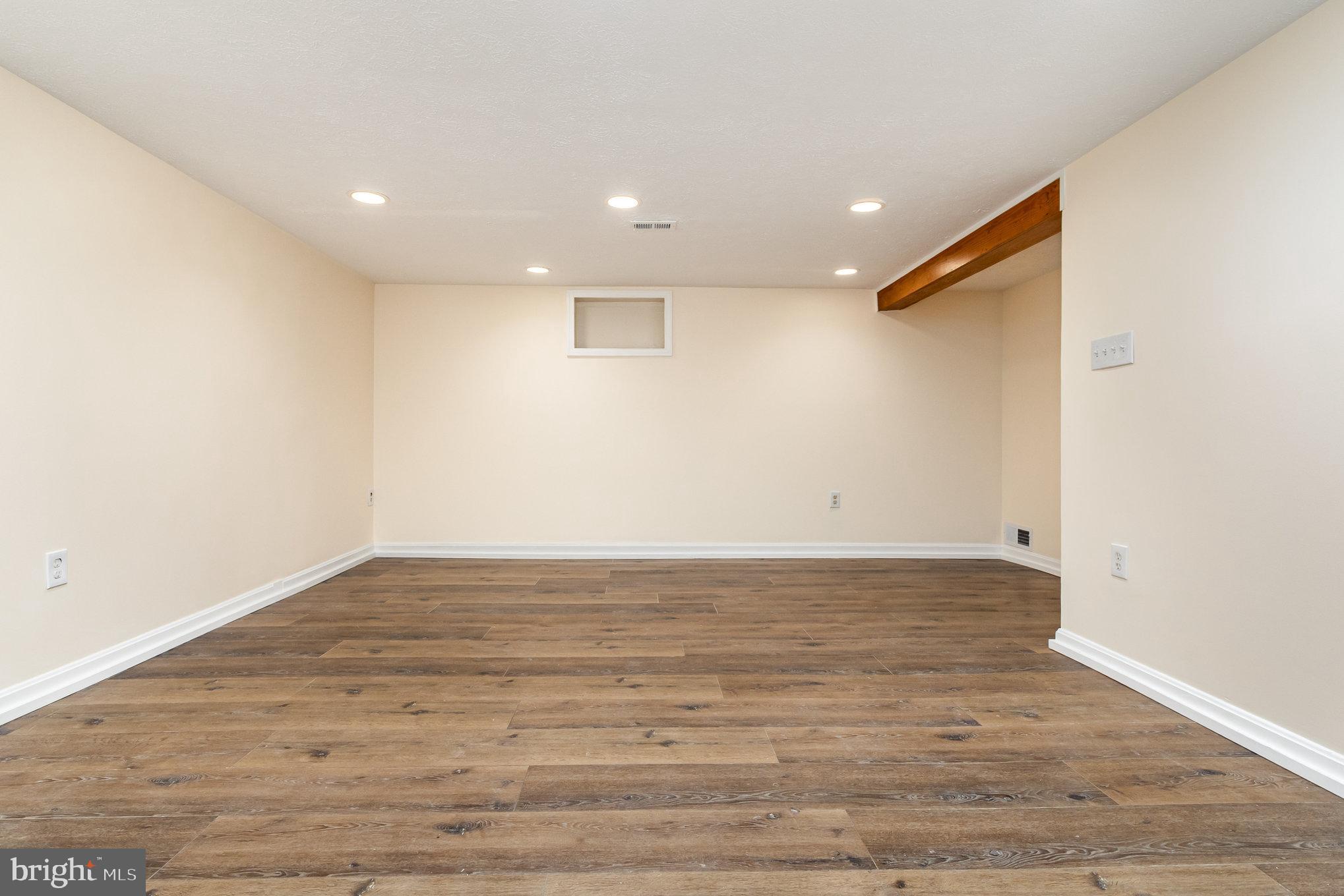 6301 Fieldvale Road Baltimore, MD 21237 - Photo 19 of 44 a view of a room with wooden floor and white walls