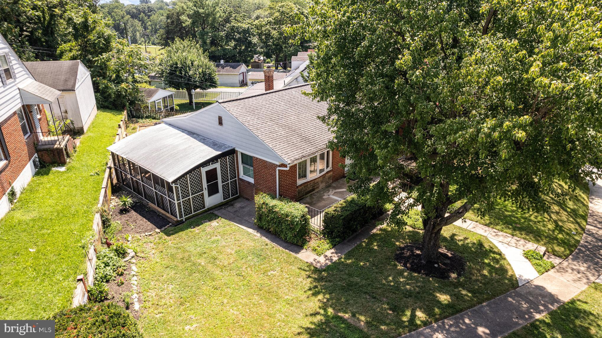 6301 Fieldvale Road Baltimore, MD 21237 - Photo 28 of 44 a view of a house with a yard and sitting area
