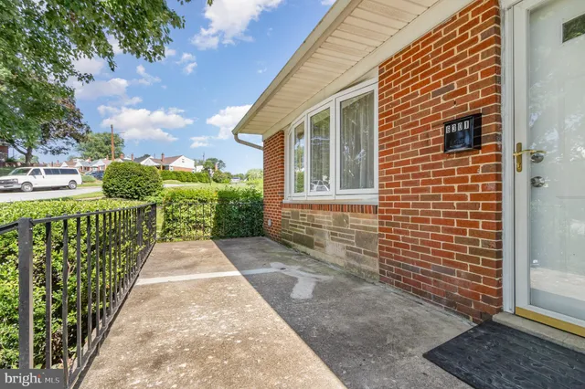 a view of a pathway both side of house