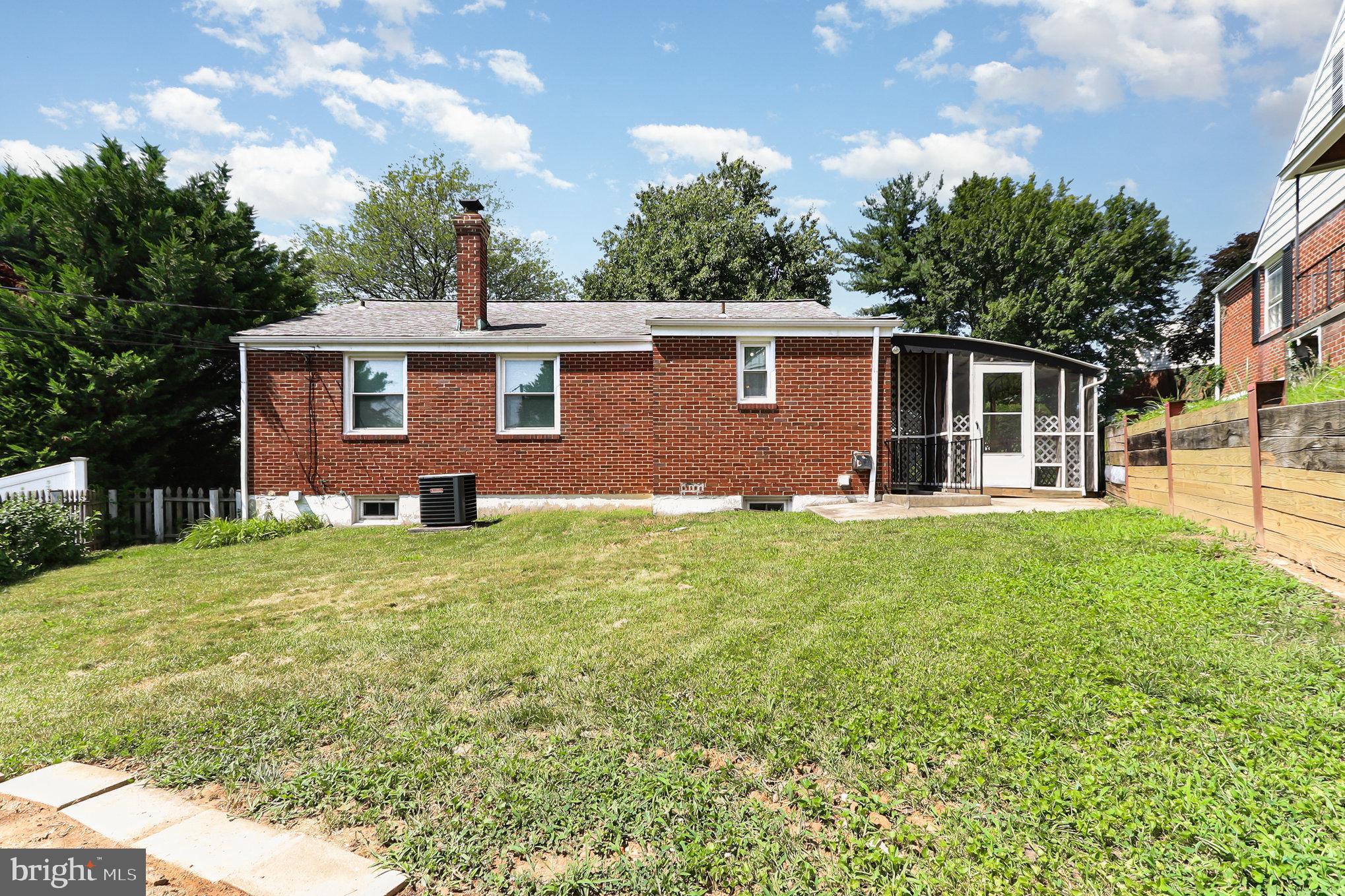 6301 Fieldvale Road Baltimore, MD 21237 - Photo 37 of 44 a front view of house with yard and green space
