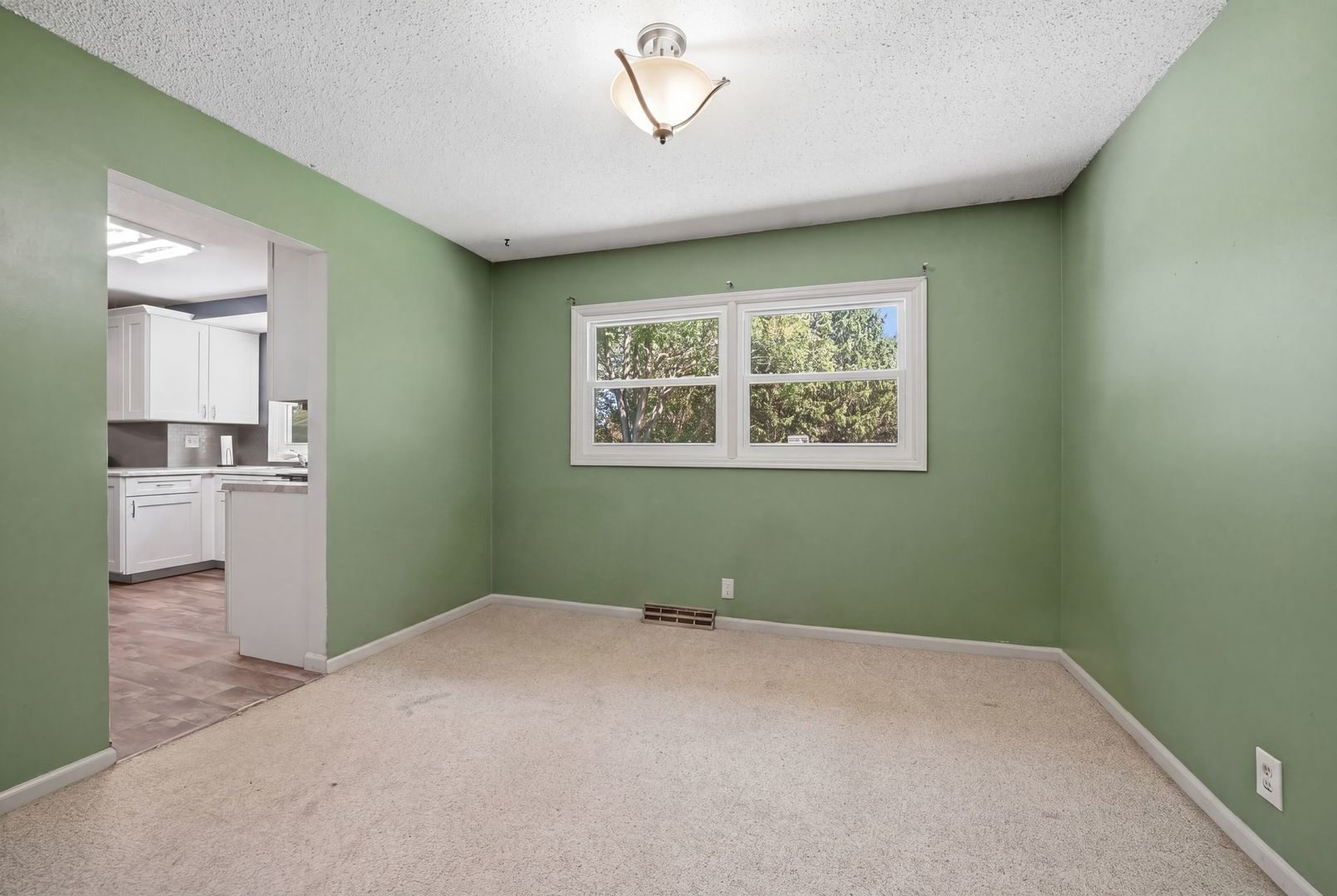 5645 Beebe Drive Rochelle, IL 61068 - Photo 11 of 43 a view of a livingroom with an empty space and a window