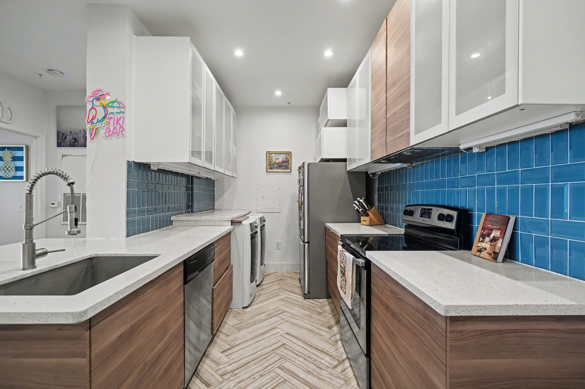 3231 Allen Parkway, Unit 2104 Houston, TX 77019 - Photo 3 of 14 The updated kitchen features quartz countertops, with washer, dryer, and refrigerator conveying with the unit.
