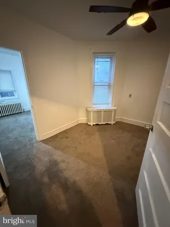 a view of backyard with barbeque grill and outdoor seating