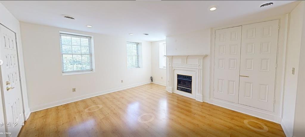 1319 Riverside Drive, Unit 100 Beaver, PA 15009 - Photo 5 of 25 a view of empty room with a fireplace and window