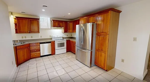 a room with washing machine and window