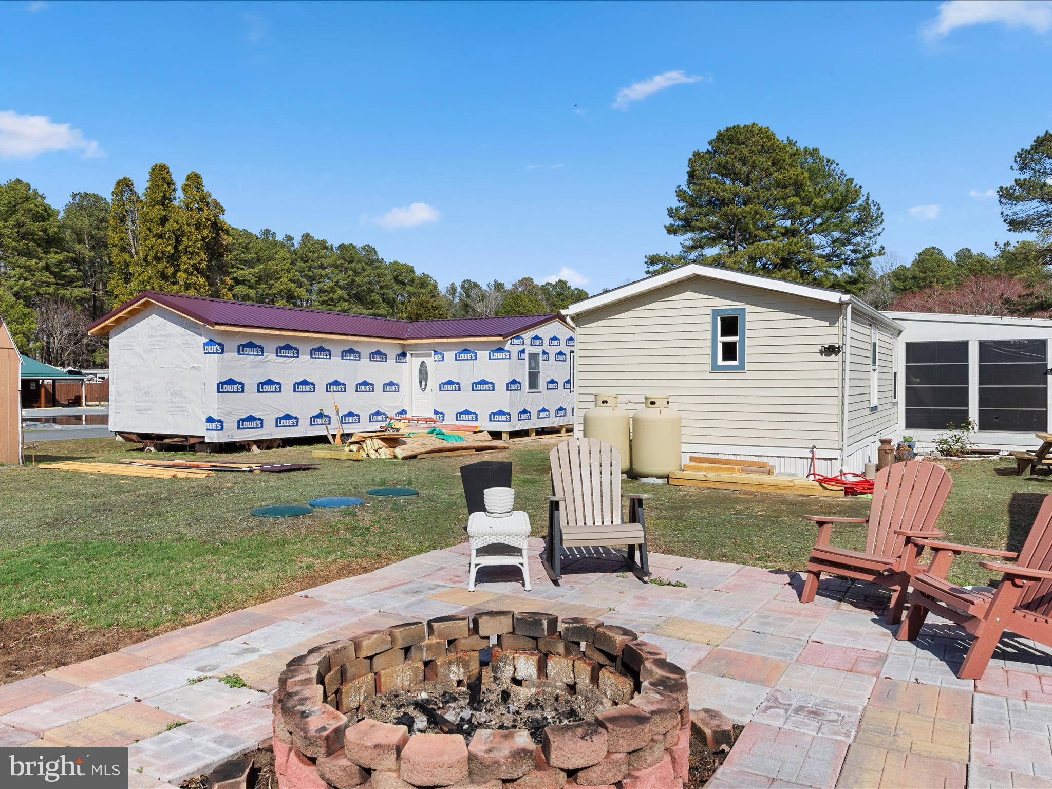 29641 Maple Road, Unit 35094 Lewes, DE 19958 - Photo 34 of 36 Patio w/Fire Pit