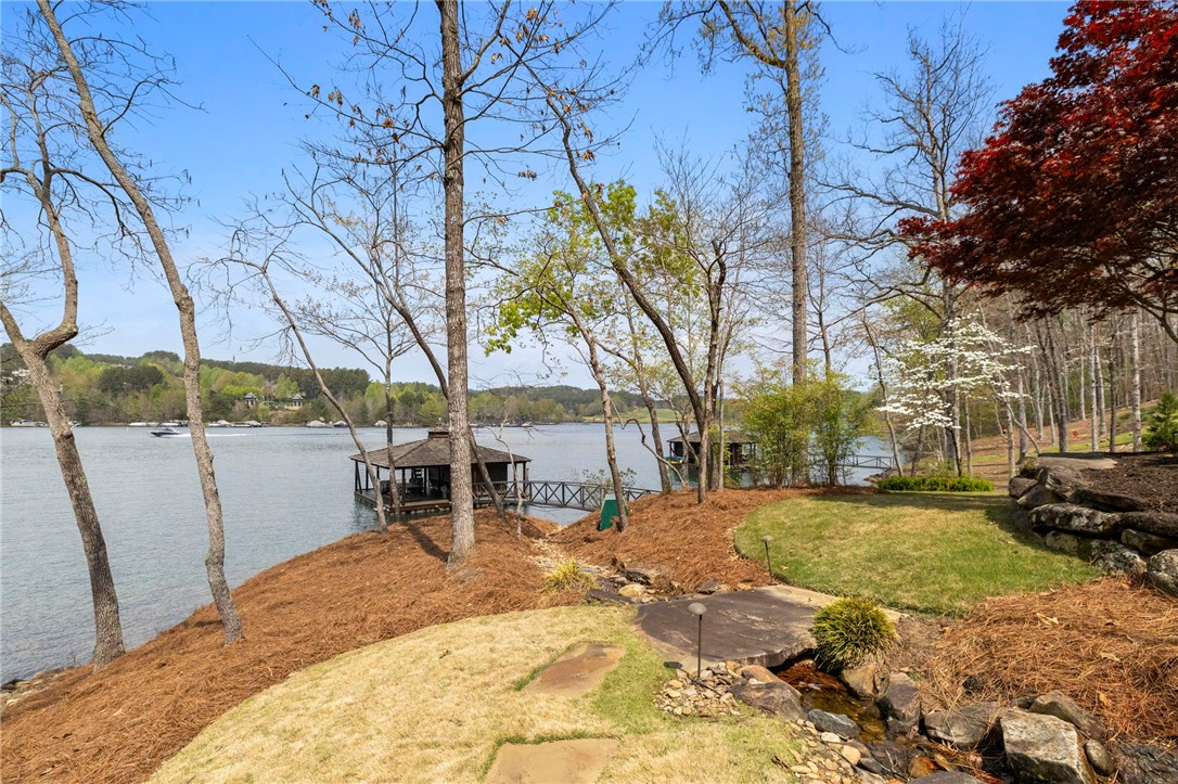 195 Village View Drive Sunset, SC 29685 - Photo 42 of 48 This serene lakeside property boasts a private dock, offering direct water access and picturesque views.