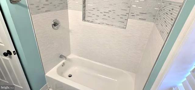 a bathroom with a sink toilet and mirror