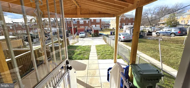 a backyard of a house with sofas