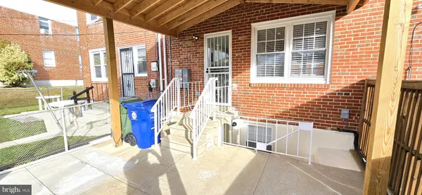 a view of a brick house with a large window