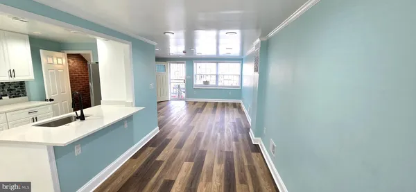 a bathroom with a sink mirror and window