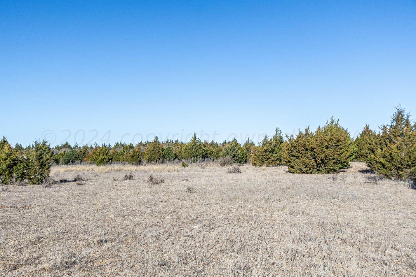 6643 Co Rd 7 Shamrock, TX 79079 - Photo 21 of 55 a view of an outdoor space with a lake view