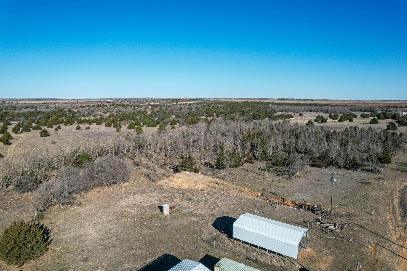 6643 Co Rd 7 Shamrock, TX 79079 - Photo 25 of 55 a view of a dry yard with wooden fence