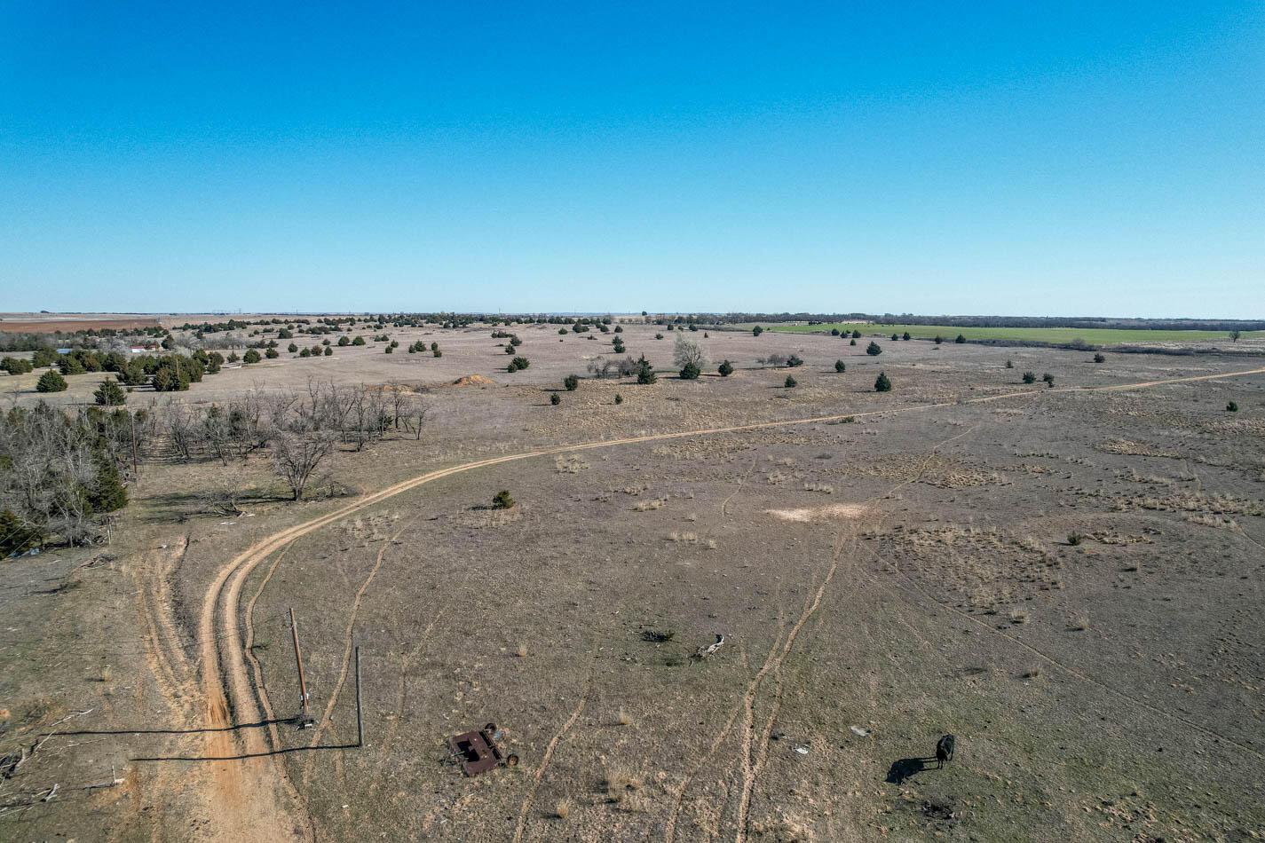 6643 Co Rd 7 Shamrock, TX 79079 - Photo 27 of 55 a view of a dry yard with wooden fence