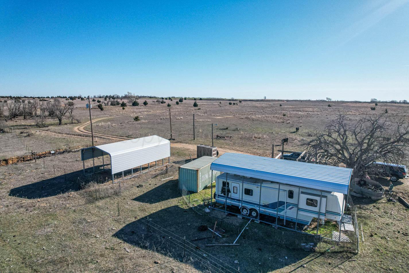 6643 Co Rd 7 Shamrock, TX 79079 - Photo 33 of 55 a view of a roof deck with table and chairs