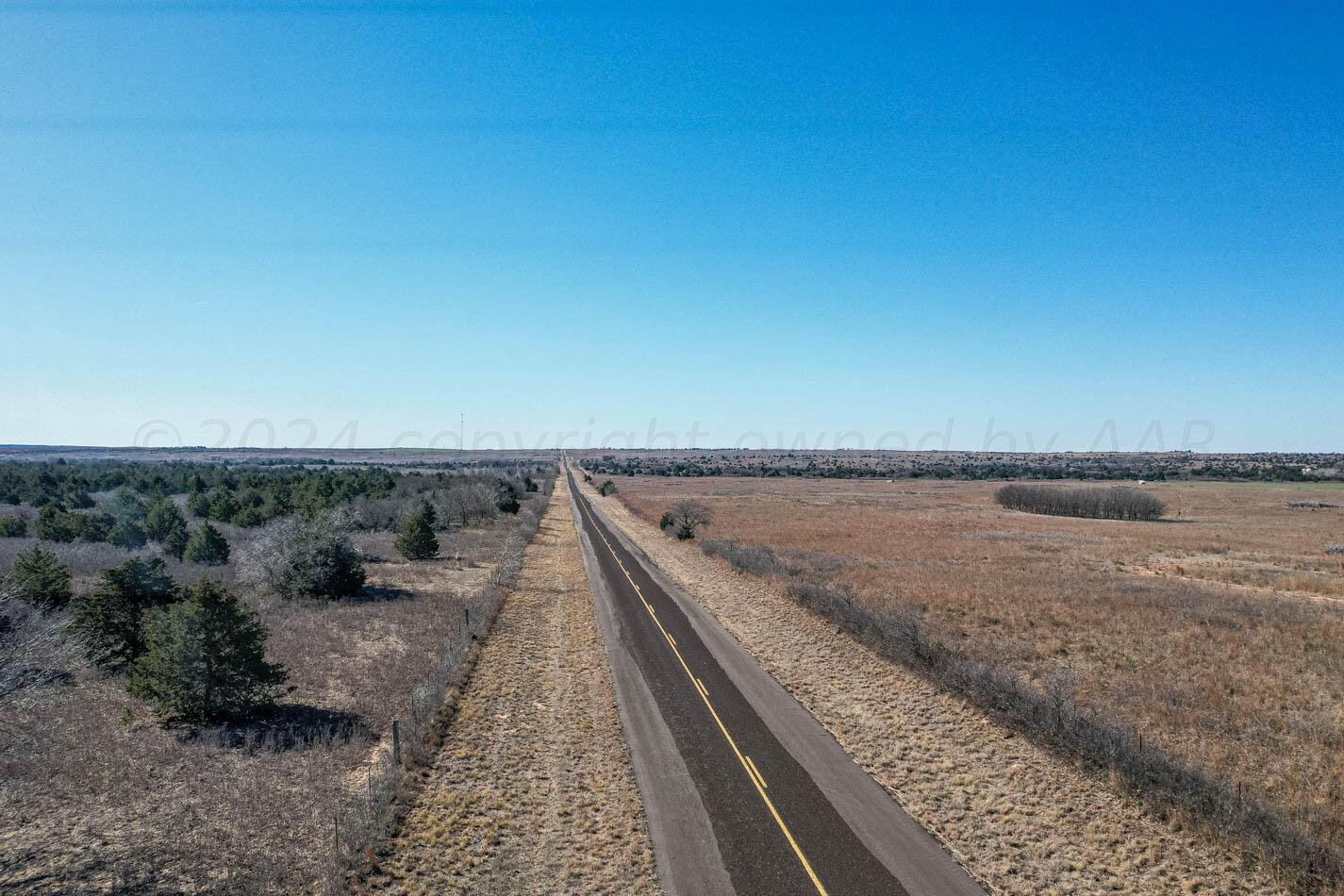 6643 Co Rd 7 Shamrock, TX 79079 - Photo 46 of 55 a view of a dry yard with wooden floor and fence