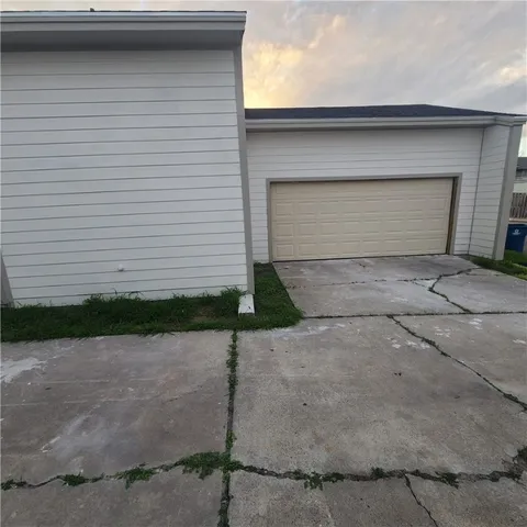 a front view of a house with garage