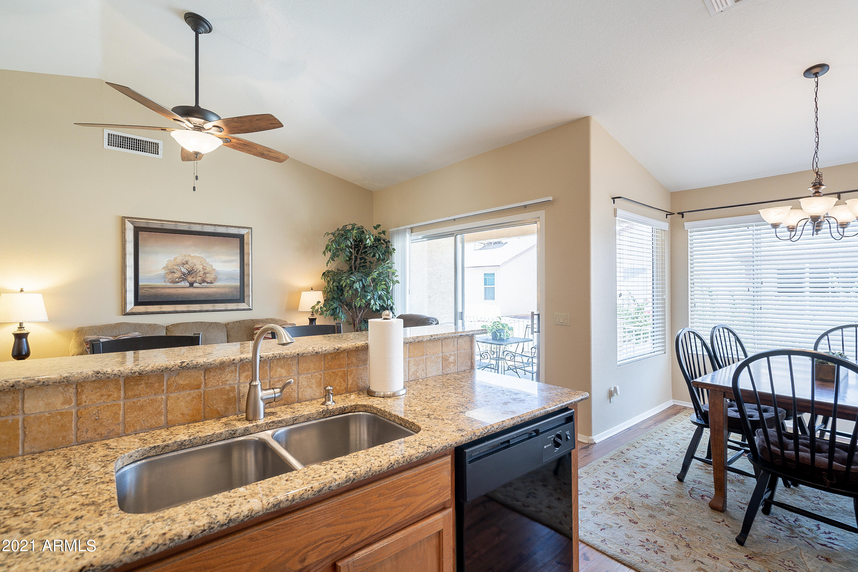 1802 East Peach Tree Drive Chandler, AZ 85249 - Photo 12 of 30 a kitchen with a table chairs and a sink