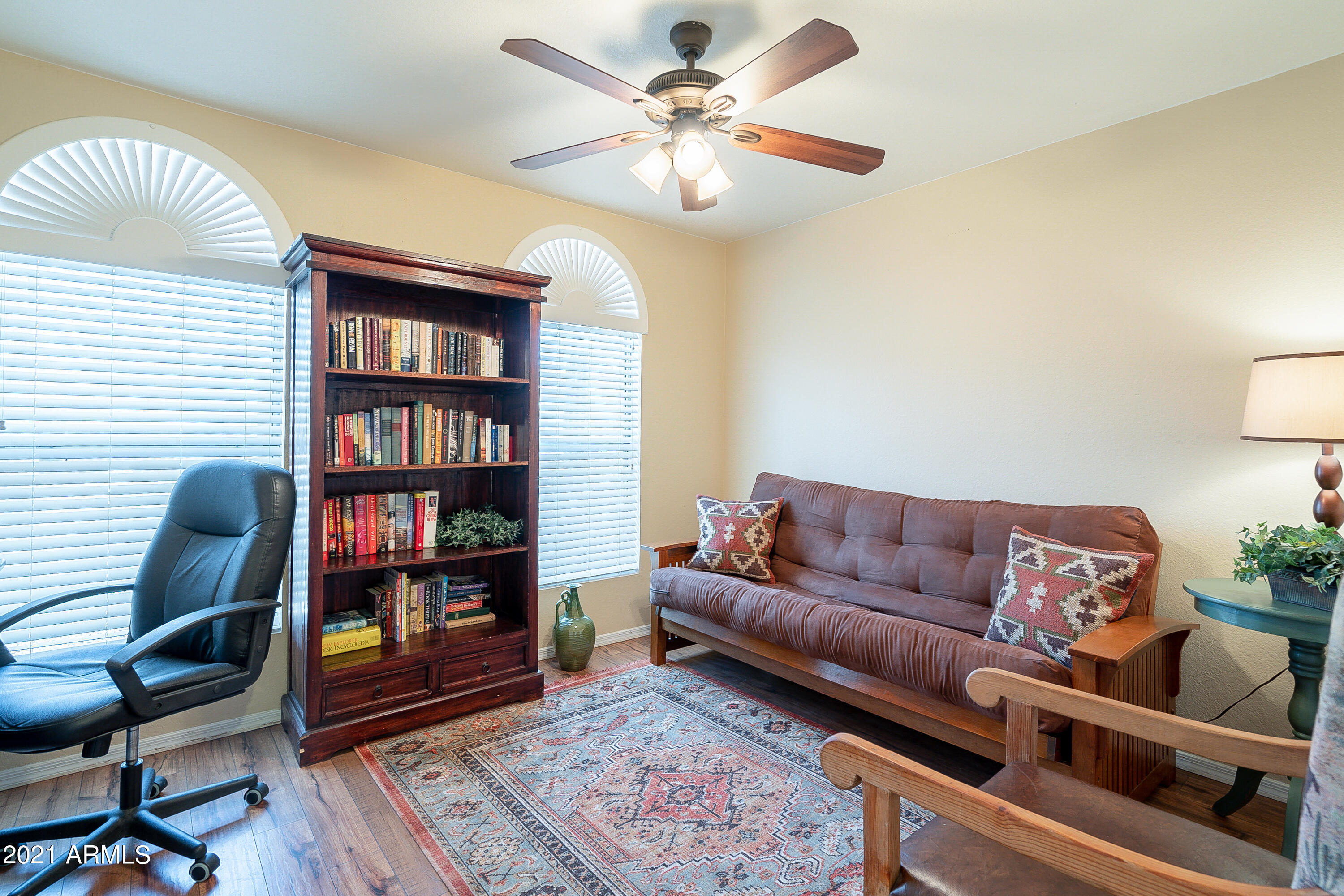 1802 East Peach Tree Drive Chandler, AZ 85249 - Photo 20 of 30 a living room with couch and a book shelf