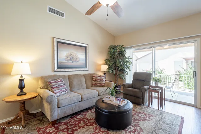 a living room with furniture and a large window