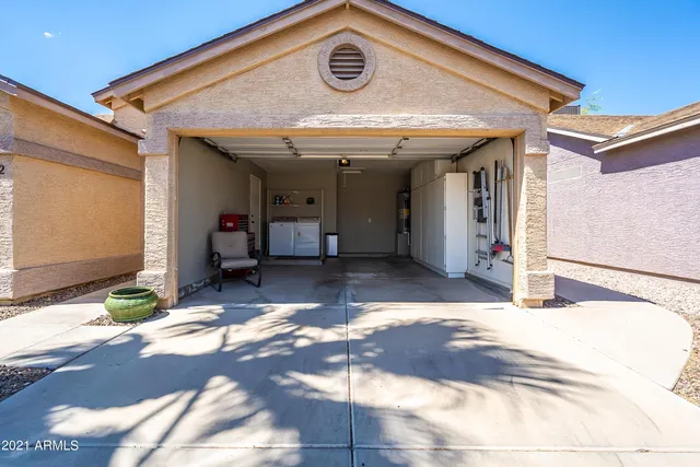 a view of a dinning table and chair in the patio