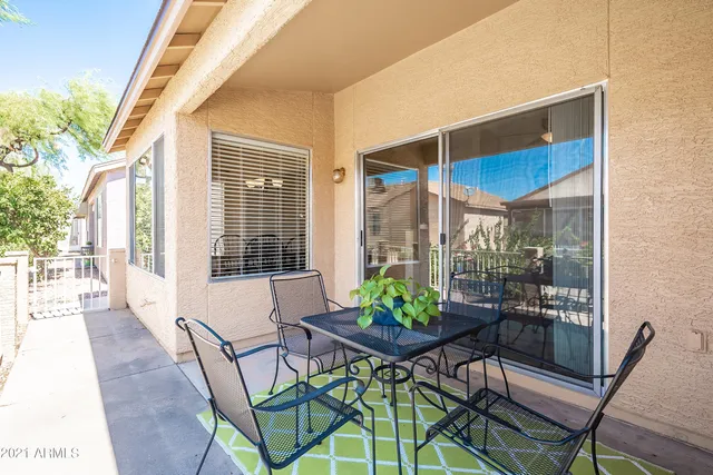 a view of an outdoor dining space with a patio