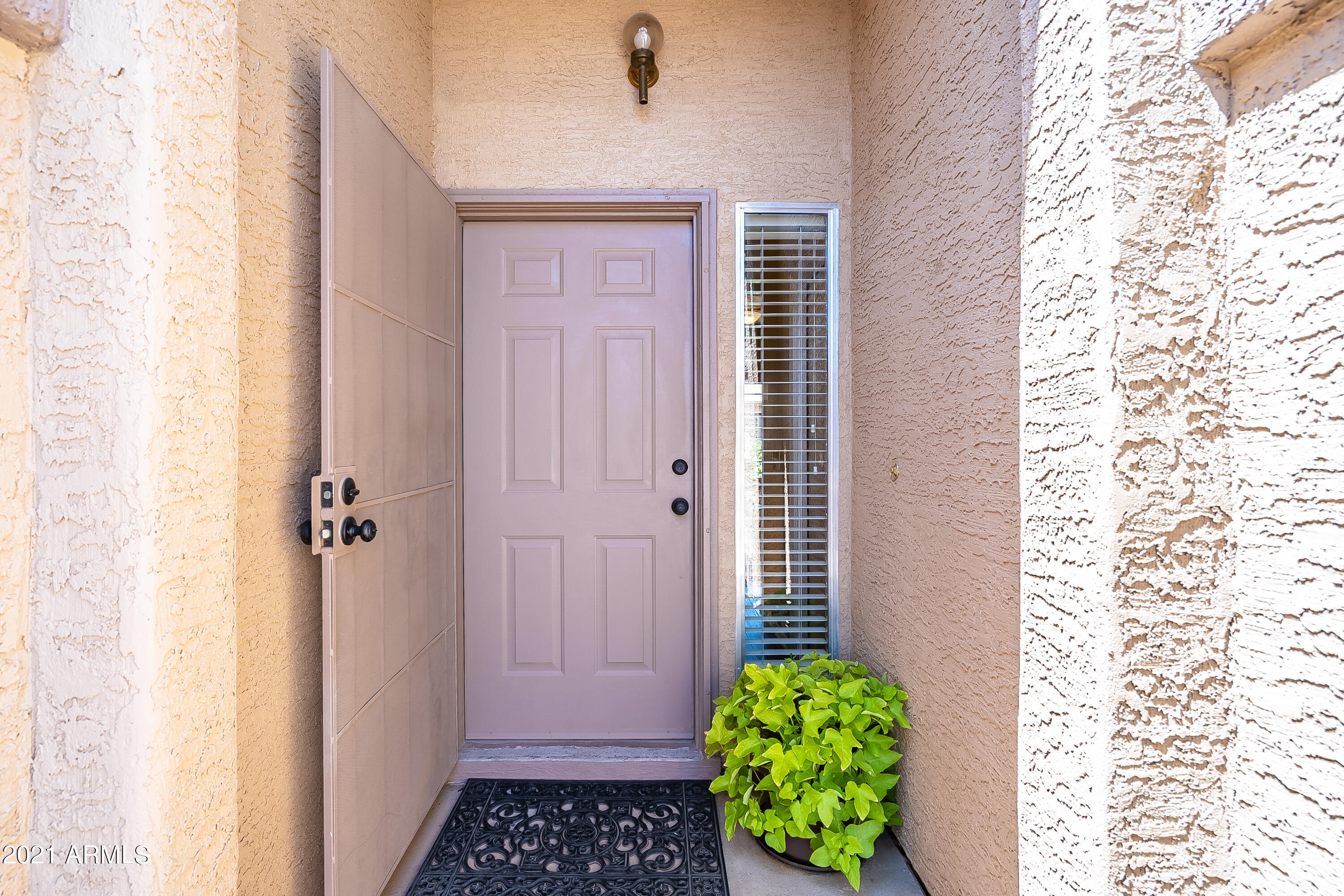 1802 East Peach Tree Drive Chandler, AZ 85249 - Photo 3 of 30 a bathroom with a shower curtain and a window