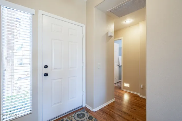 a view of a bathroom with wooden floor