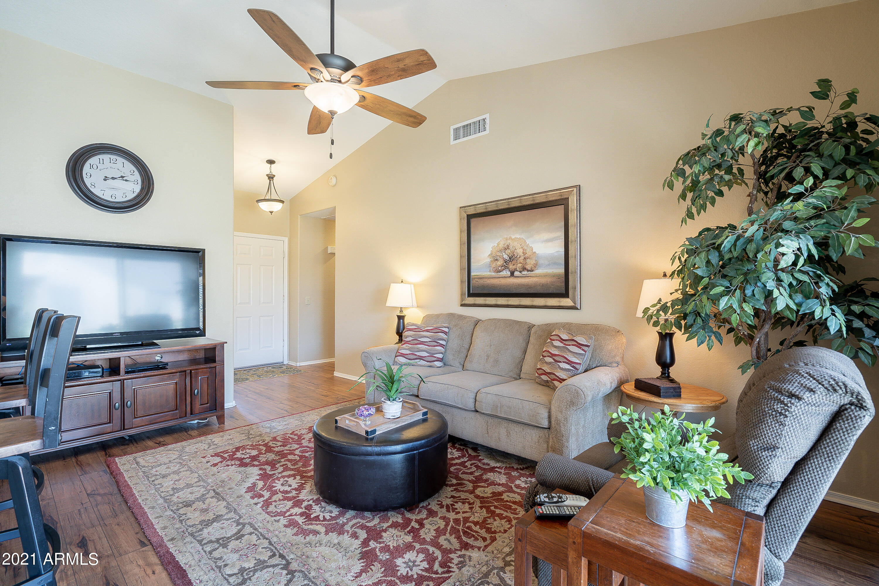 1802 East Peach Tree Drive Chandler, AZ 85249 - Photo 7 of 30 a living room with furniture a rug potted plant and a window
