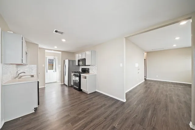 a view of kitchen with wooden floor