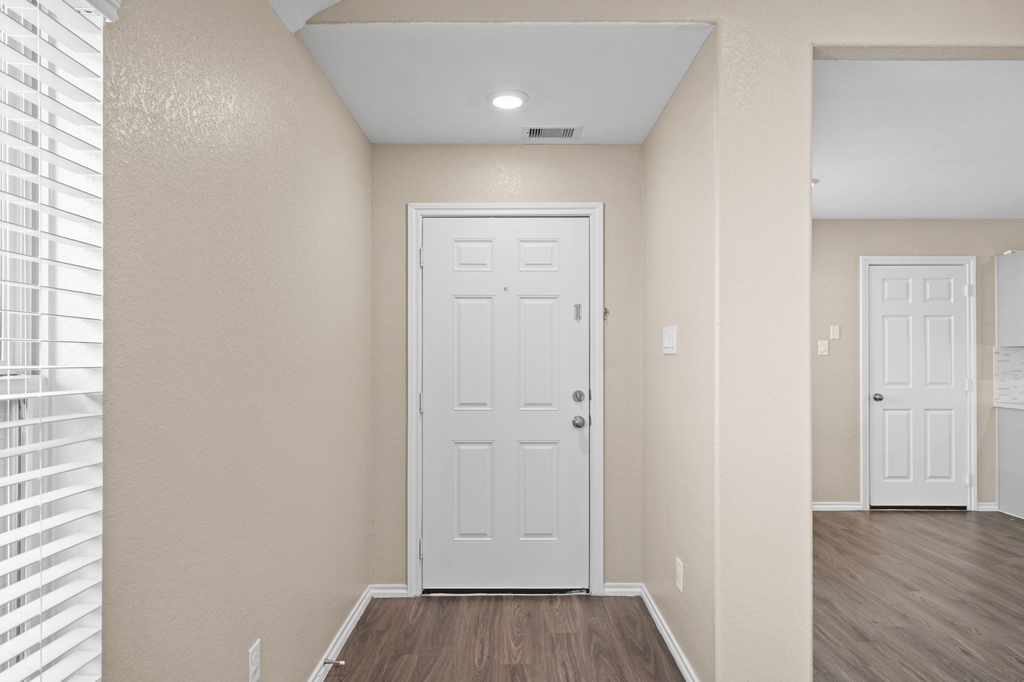7823 Winward Ridge Way Katy, TX 77493 - Photo 6 of 25 a view of a hallway with wooden floor