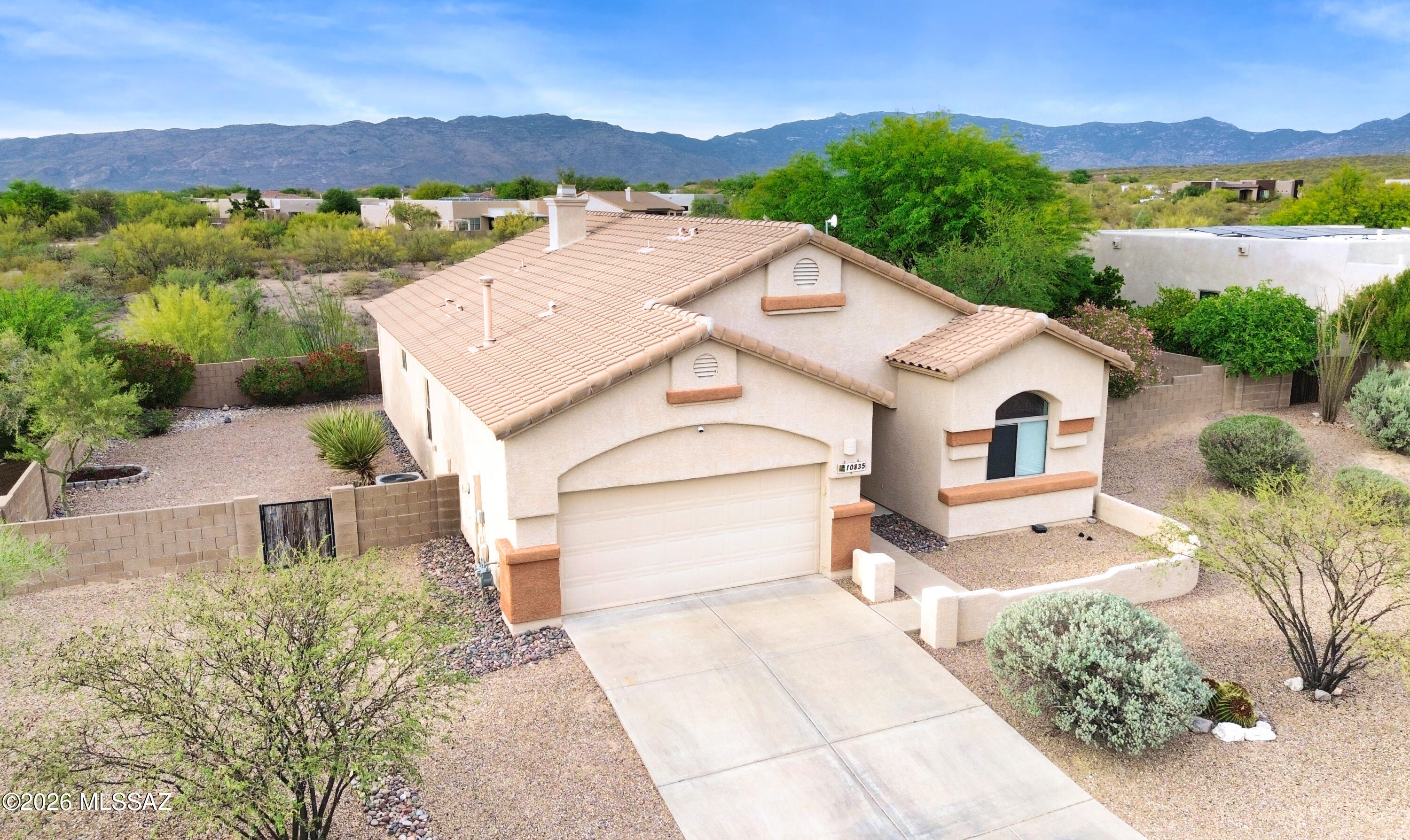 10835 South Heart Break Ridge Place Vail, AZ 85641 - Photo 3 of 49 a view of a house with a yard and a large tree