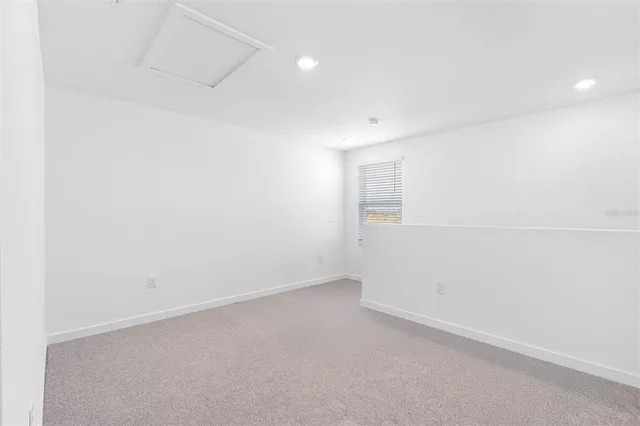 an empty room with a empty space and window