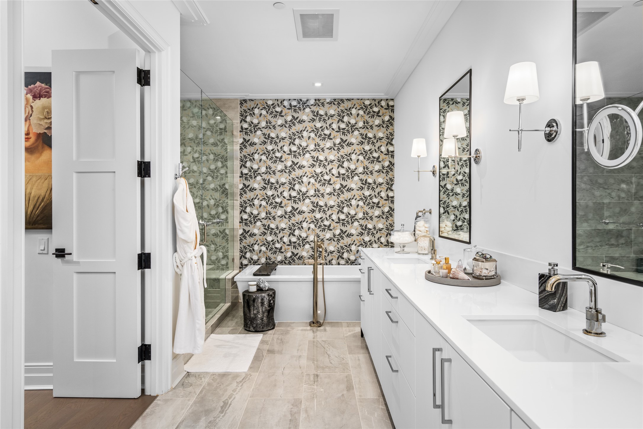6017 Memorial Drive, Unit 202 Houston, TX 77007 - Photo 14 of 36 The enormous primary bathroom is a personal sanctuary - adorned with marble floors and tile surround, quartz counters, white lacquer Siematic cabinetry, and chrome sconces flanking your double sink vanity, This bathroom is a sight to behold.
