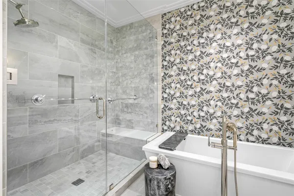 a bathroom with a shower toilet and a sink