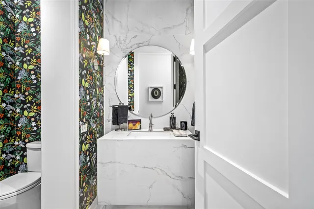 a utility room with sink dryer and washer