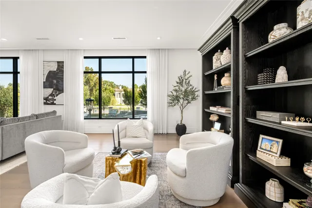 a living room with furniture fireplace and window