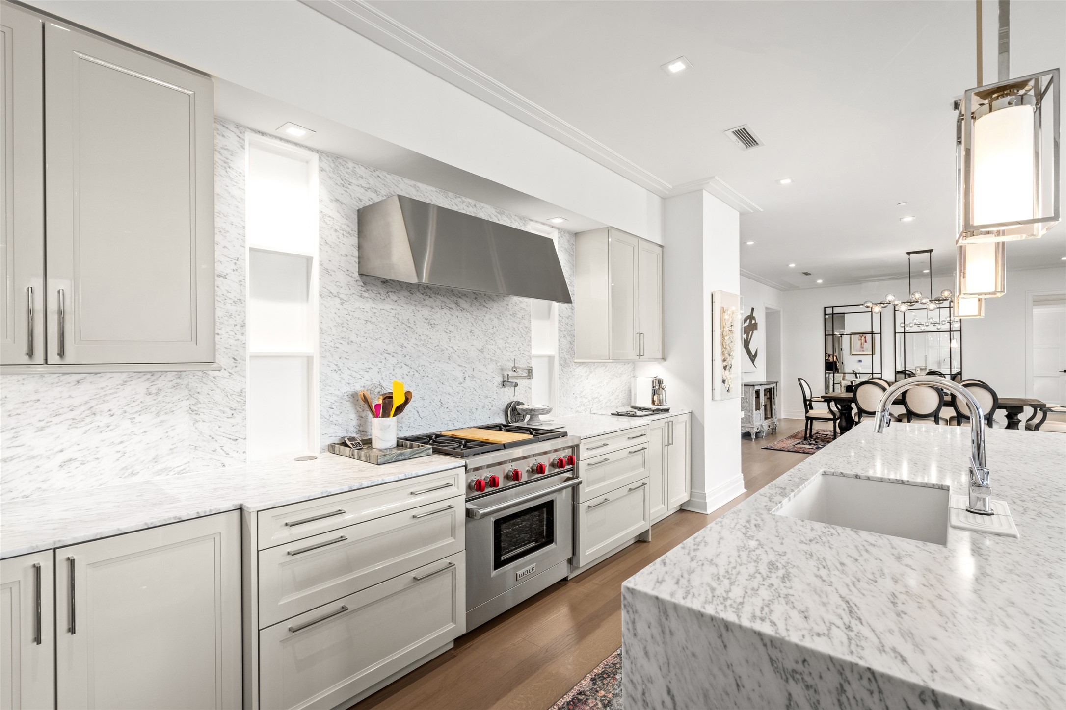 6017 Memorial Drive, Unit 202 Houston, TX 77007 - Photo 6 of 36 Top of the line Wolf gas range with pot filler, Integrated SubZero Fridge, Freezer, and wine fridge, this kitchen is chef capable.