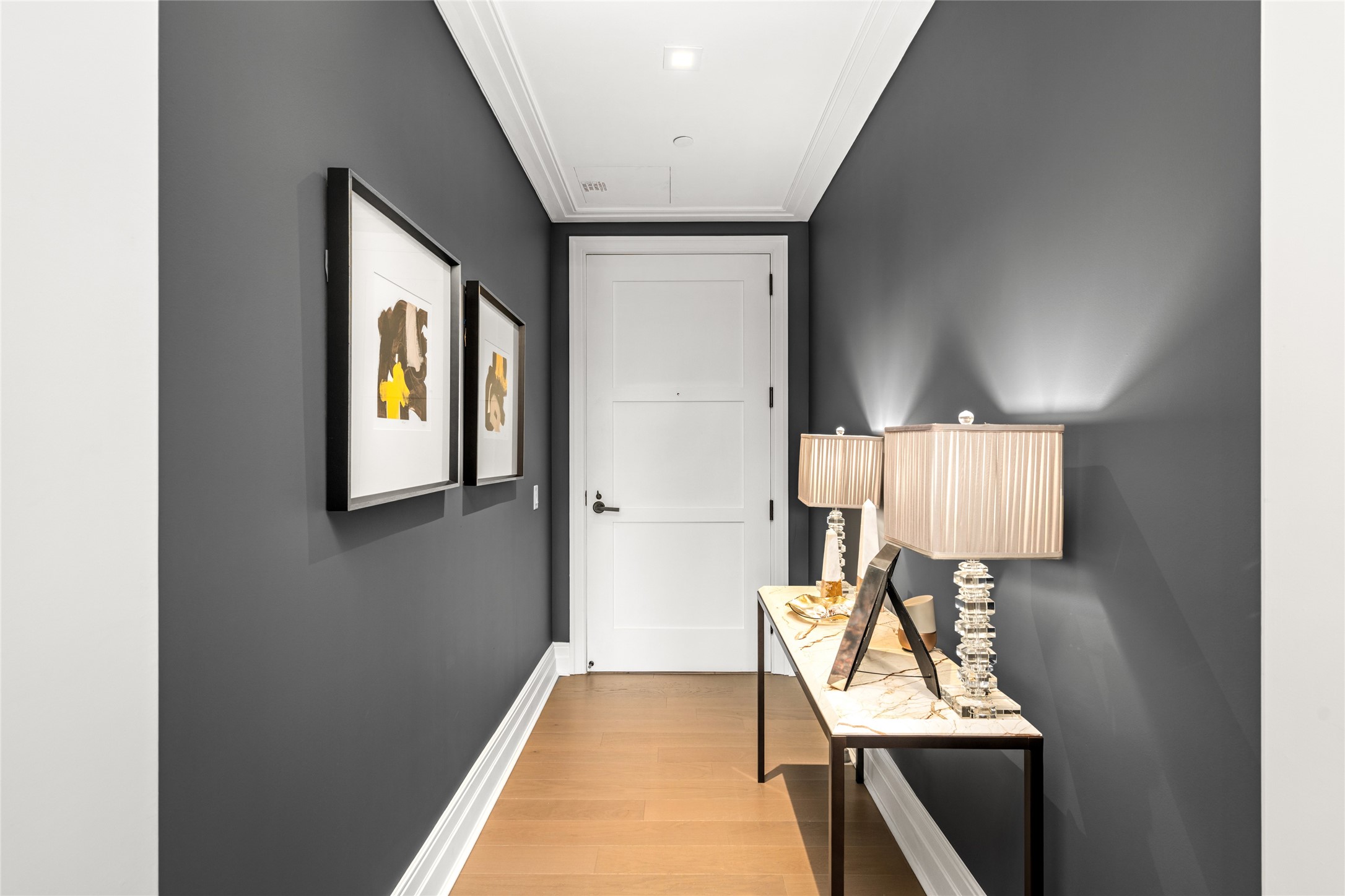 6017 Memorial Drive, Unit 202 Houston, TX 77007 - Photo 8 of 36 Unit 202 opens to a charming hallway, offering a warm introduction to an upscale setting.